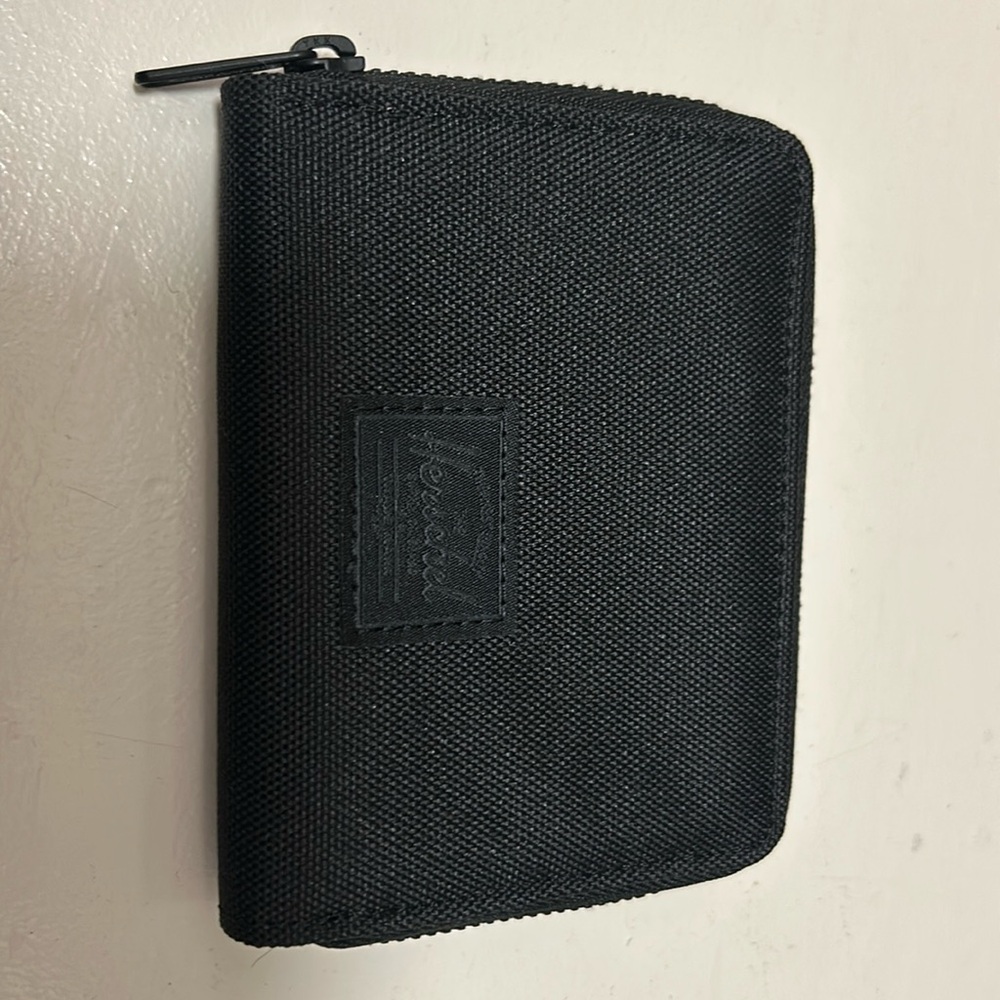 Herschel credit card wallet. 4.5 wide by 3.75 high. Never used